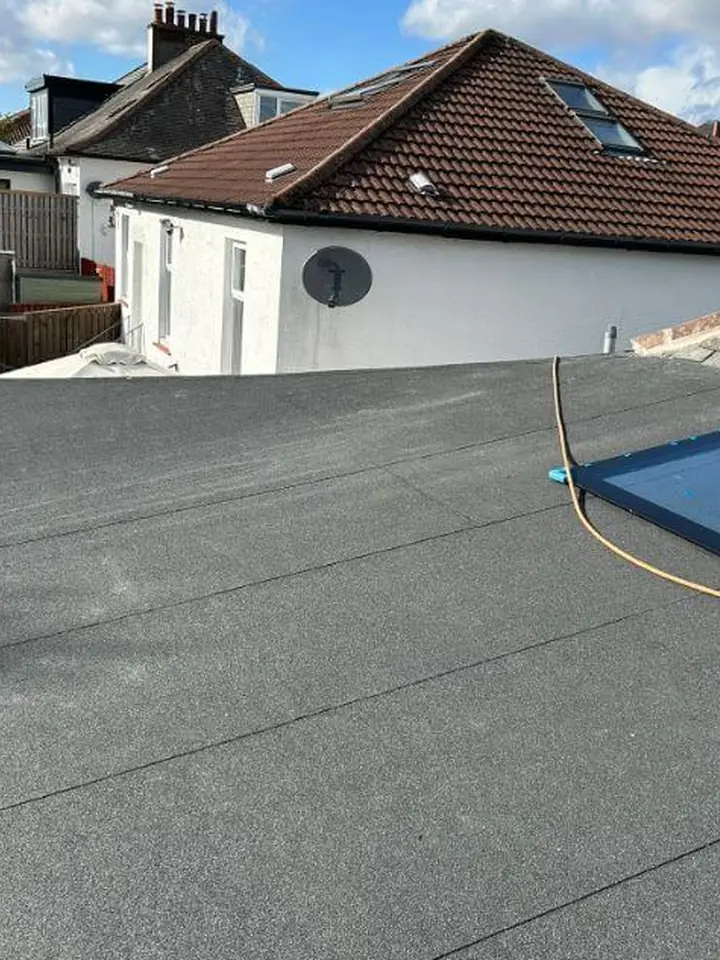 Finished felt flat roof with a roof window